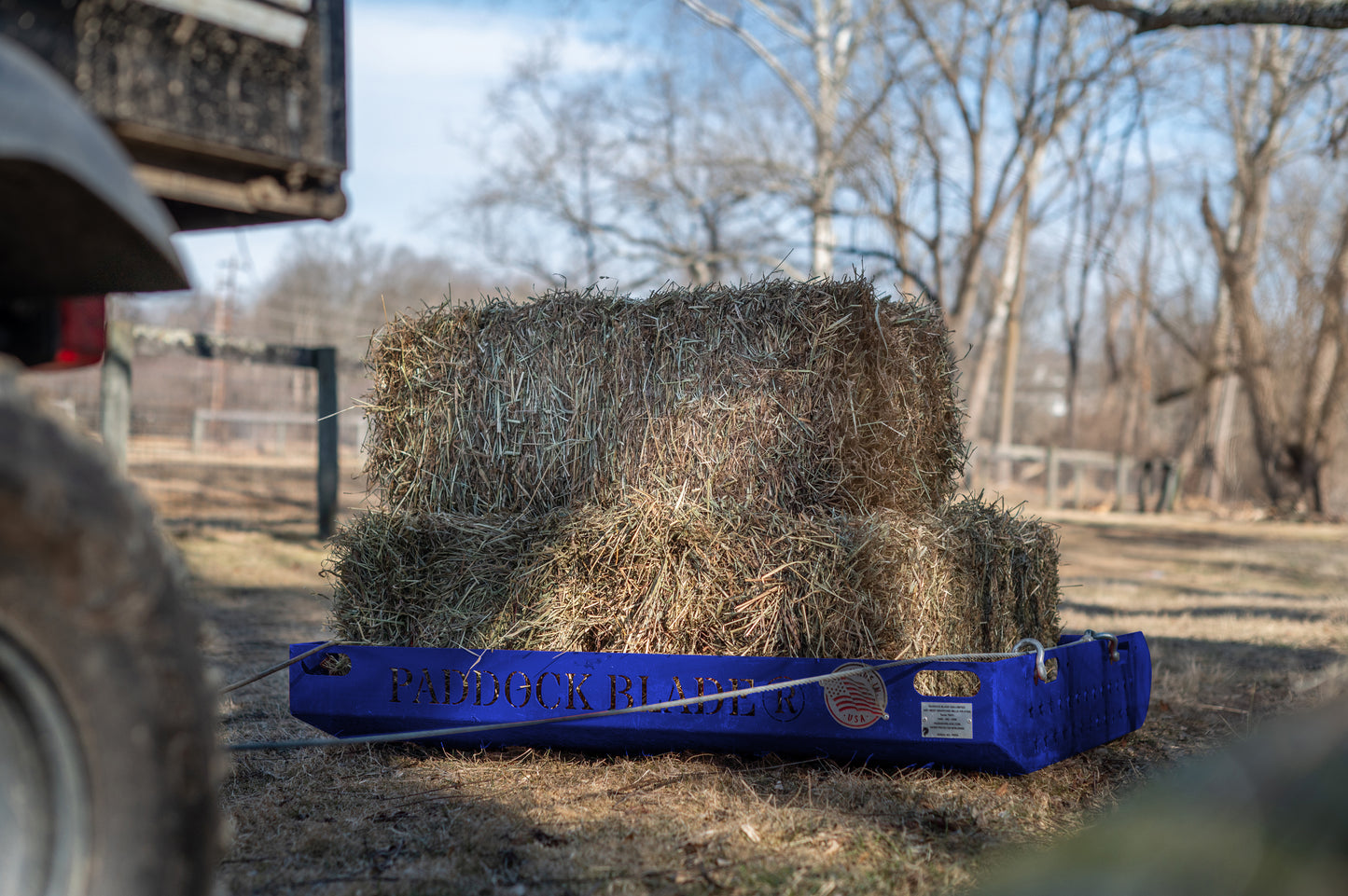 paddock blade moving hay bales